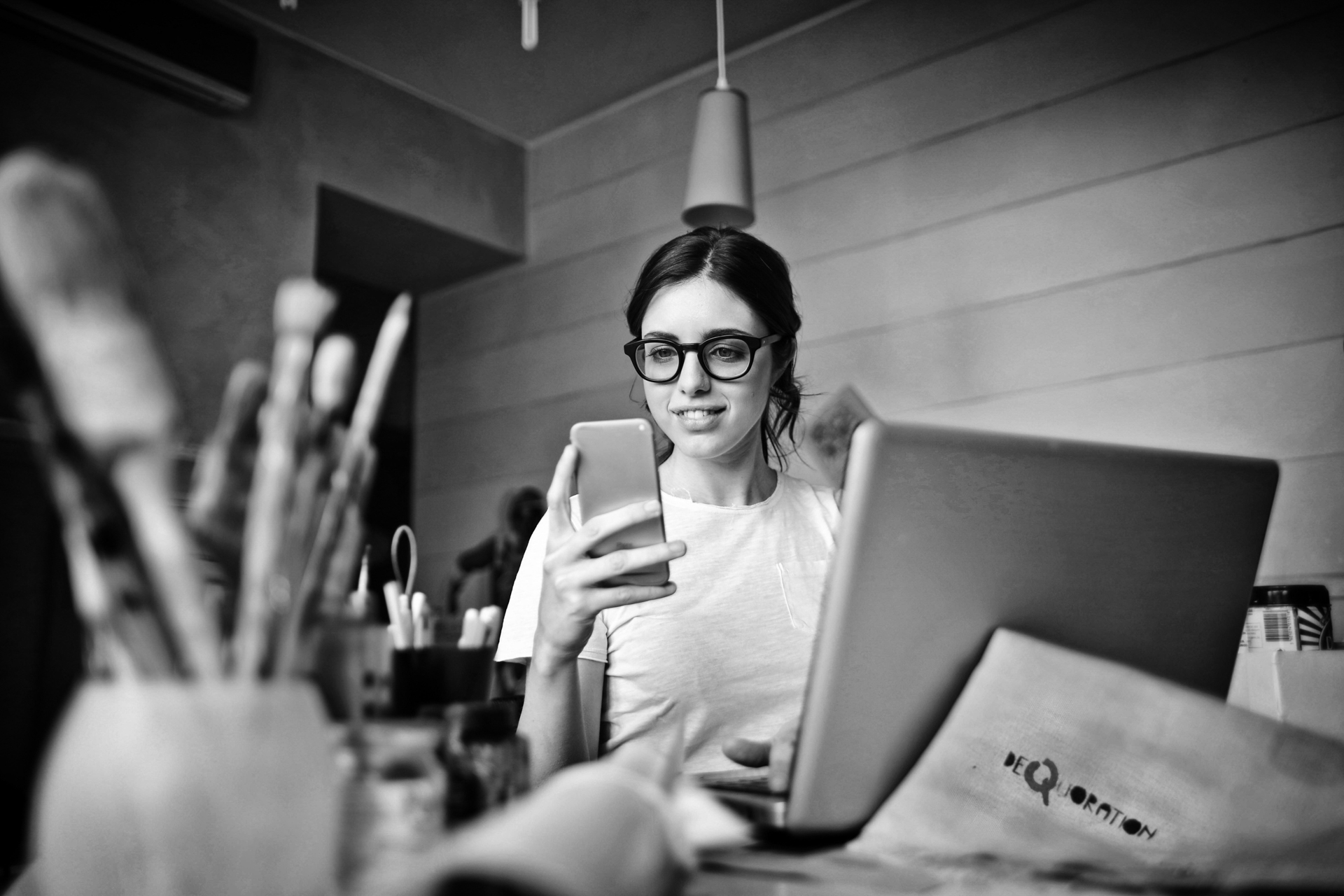 Girl at her desk about to make a phone call